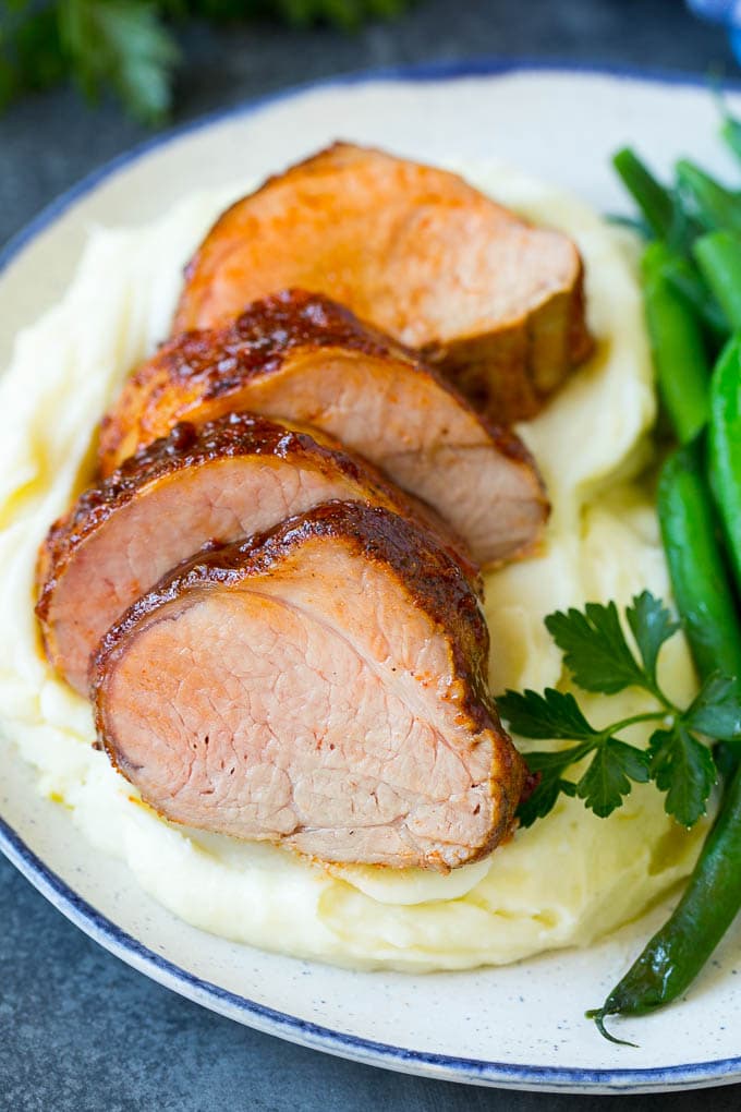Smoked Pork Tenderloin Recipe | Smoked Pork Loin | BBQ Pork #pork #tenderloin #smoker #dinner #sadud Sliced smoked pork tenderloin served with mashed potatoes and vegetables.