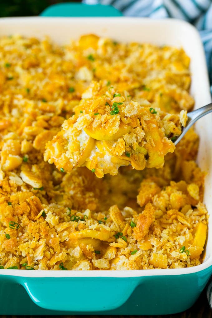 Squash Casserole Recipe | Vegetable Casserole | Zucchini Casserole #casserole #squash #zucchini #cheese #sidedish #sadud A spoon serving up a portion of cheesy squash casserole.
