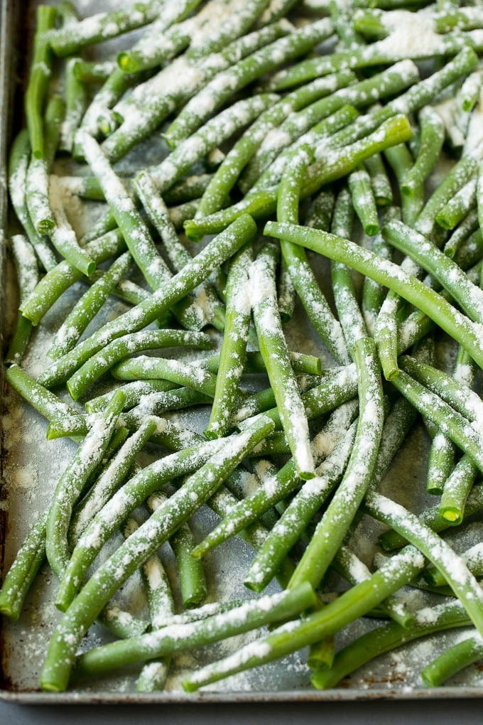 Fried Green Beans Recipe | Green Beans #greenbeans #appetizer #snack #sadud Bean coated in flour on a pan.