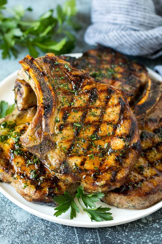 Grilled Pork Chops | Pork Chop Marinade #porkchops #grilling #pork #marinade #dinner #sadud Grilled pork chops coated in marinade then cooked and garnished with parsley.