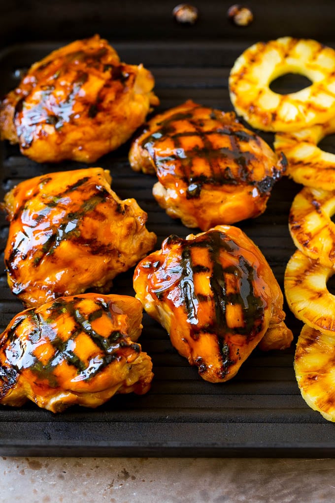 Huli Huli Chicken Recipe | Hawaiian Chicken | Grilled Chicken Thighs #chicken #pineapple #grilling #dinner #sadud Poultry and pineapple slices on a grill pan.