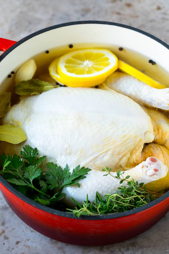 Rotisserie Chicken Recipe | Roasted Chicken #chicken #dinner #sadud #comfortfood A whole chicken in a pot of brine.