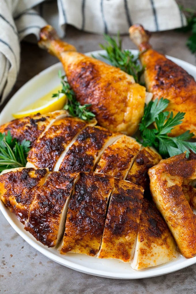 Rotisserie Chicken Recipe | Roasted Chicken #chicken #dinner #sadud #comfortfood Sliced roasted chicken on a serving plate.