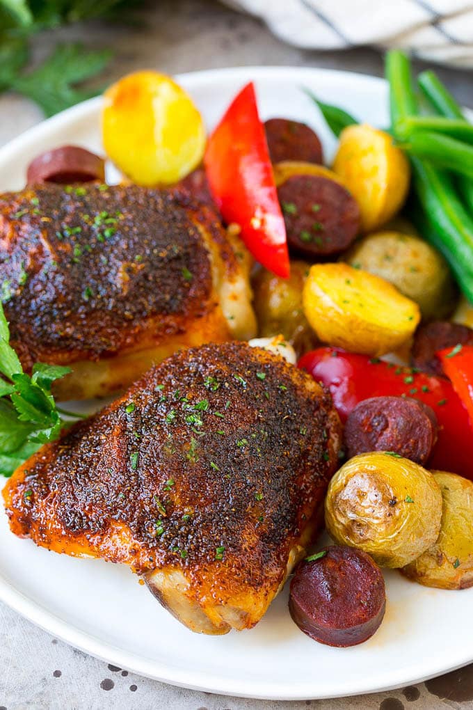 Spanish Chicken Recipe | Sheet Pan Meal | Chicken and Potatoes #spanishfood #chicken #sausage #potatoes #dinner #sadud A plate of Spanish chicken with potatoes, sausage and vegetables.