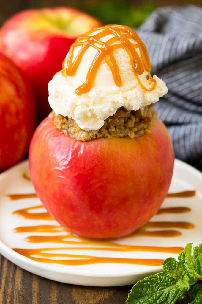 Baked Apples | Stuffed Apples #apples #fall #dessert #sweettooth #sadud A baked apple topped with vanilla ice cream and caramel sauce.