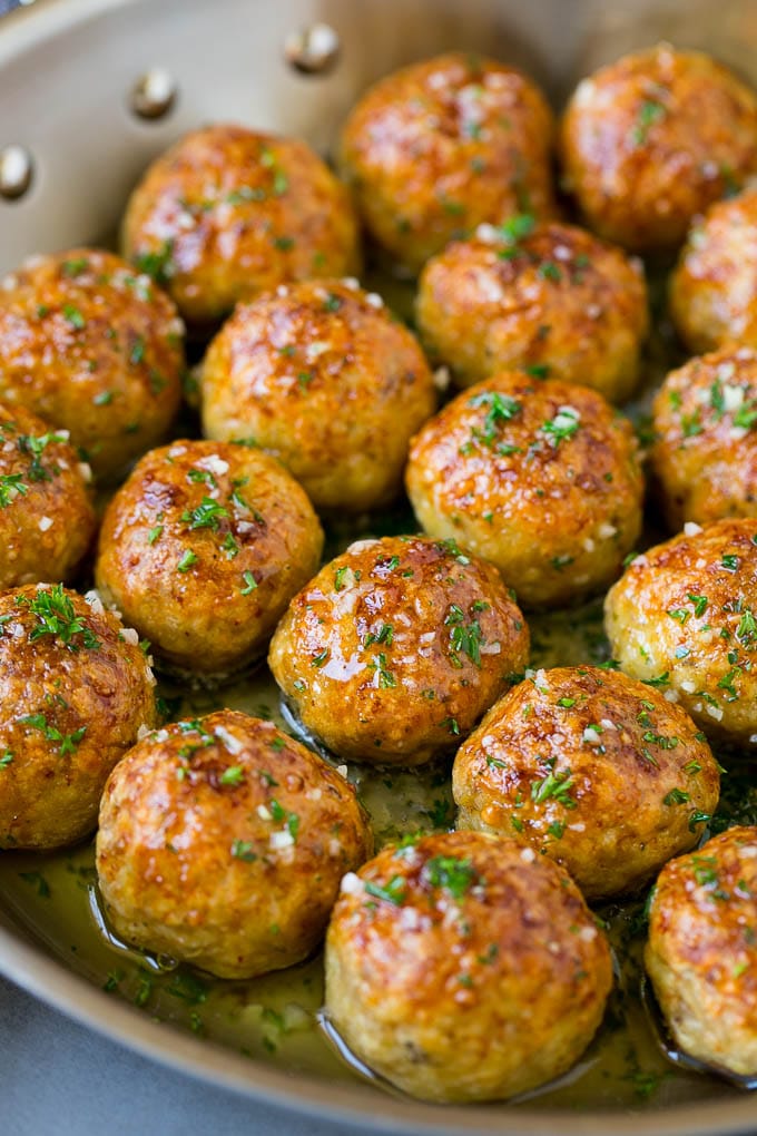 Chicken Meatballs Recipe | Baked Meatballs #chicken #meatballs #dinner #sadud #comfortfood Chicken meatballs in a skillet of garlic butter.
