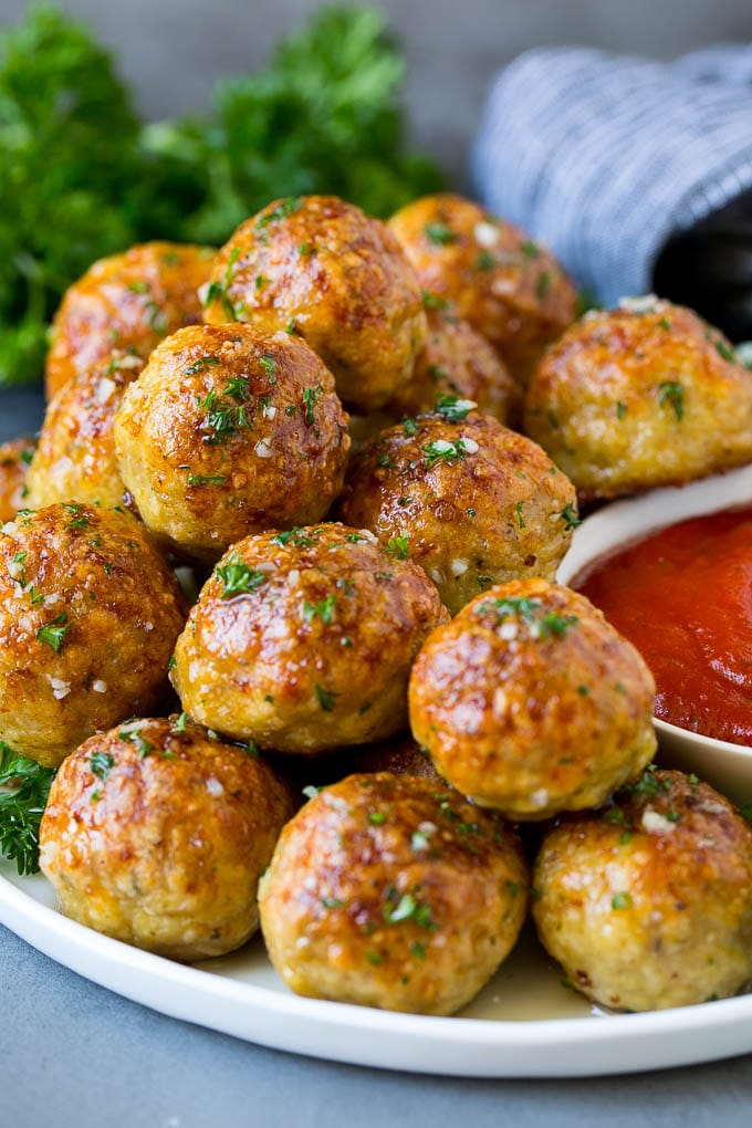 Chicken Meatballs Recipe | Baked Meatballs #chicken #meatballs #dinner #sadud #comfortfood A serving plate of chicken meatballs served with marinara sauce.