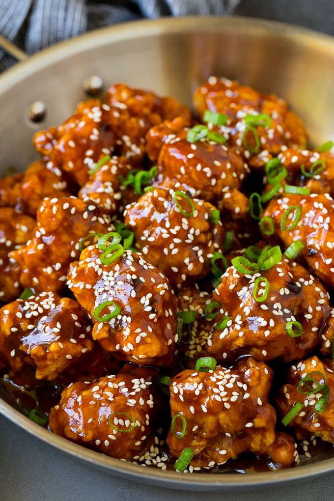 General Tso's Chicken Recipe #chicken #asianfood #dinner #sadud #copycatrecipe General Tso's chicken in a pan coated in a sweet and spicy sauce.