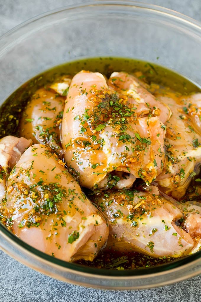 Grilled Chicken Thighs Recipe | Marinated Chicken Thighs #chicken #grilling #marinade #dinner #cilantro #lime #sadud Poultry in a bowl of marinade.