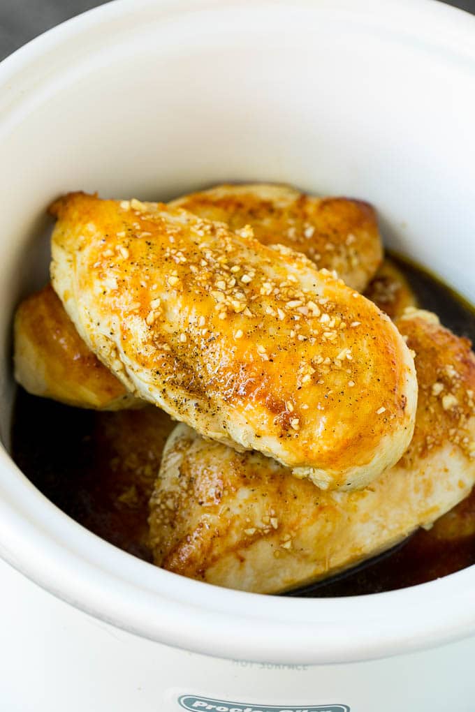 Slow Cooker Chicken Breast Recipe | Crock Pot Chicken Breast | Chicken and Gravy #chicken #slowcooker #crockpot #gravy #dinner #sadud Chicken breasts with garlic and herb sauce poured over the top.