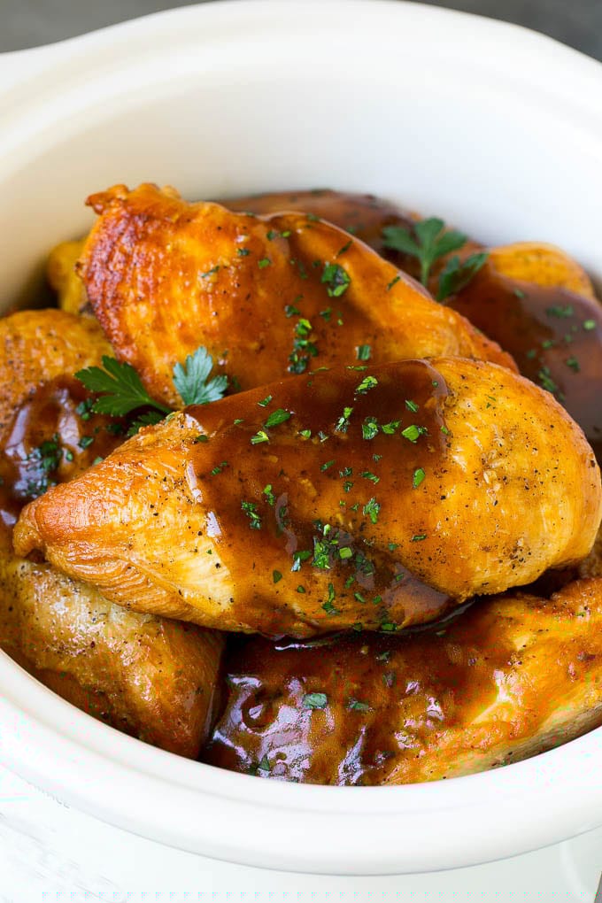 Slow Cooker Chicken Breast Recipe | Crock Pot Chicken Breast | Chicken and Gravy #chicken #slowcooker #crockpot #gravy #dinner #sadud Slow cooker chicken breast topped with gravy and parsley.