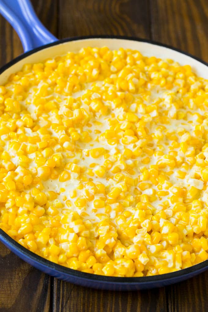 This creamed corn recipe consists of corn kernels simmered in cream sauce, then topped with crispy bacon and fresh herbs. Corn kernels cooked in a creamy sauce.