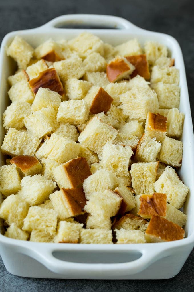 French Toast Casserole Recipe | French Toast Bake #frenchtoast #casserole #breakfast #brunch #sadud #bread Cubes of bread in a baking dish.