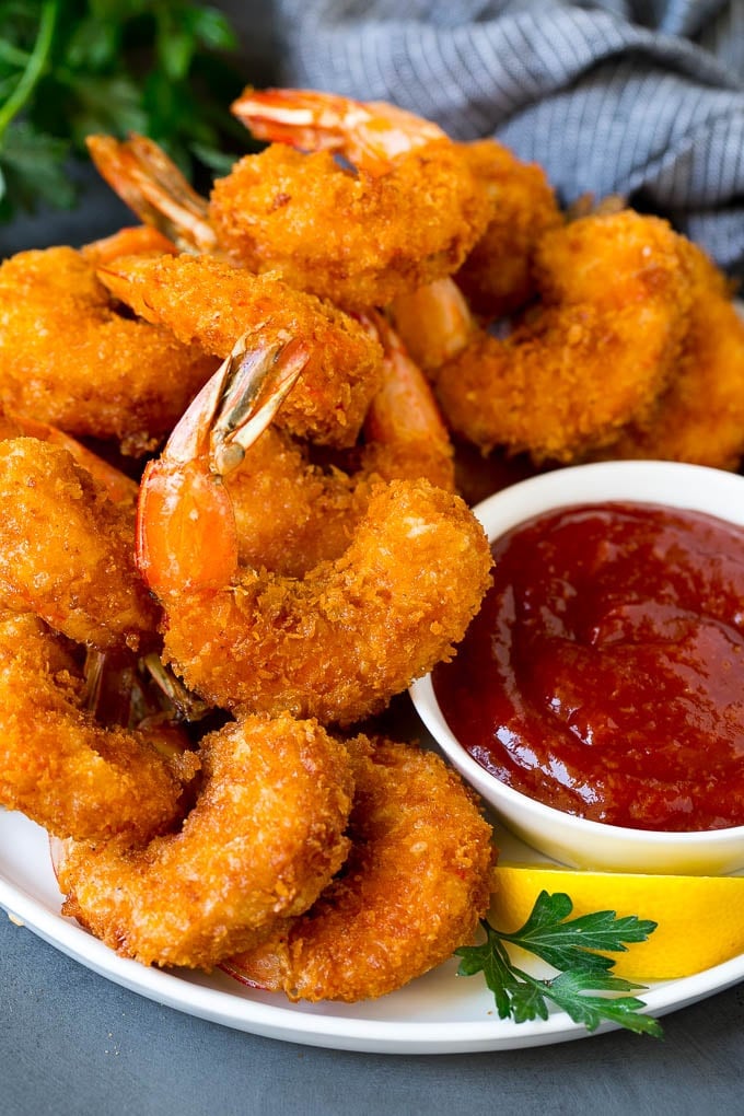 Fried Shrimp Recipe #shrimp #seafood #dinner #appetizer #sadud A plate of fried shrimp served with cocktail sauce.
