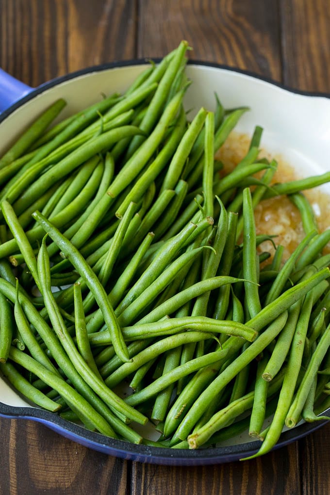 Green Beans with Bacon Recipe | Bacon Green Beans #bacon #greenbeans #sidedish #thanksgiving #veggies #dinner #sadud Beans in a pan with onions.