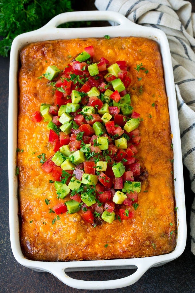 Sausage Egg Casserole Recipe | Egg Casserole #eggs #sausage #potato #cheese #casserole #breakfast #brunch #sadud Sausage egg casserole topped with avocado and tomato.