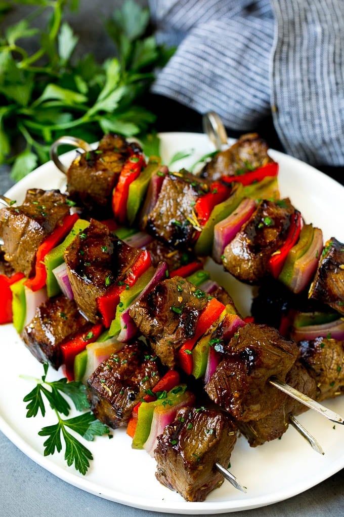 Beef Shish Kabobs Recipe | Beef Kabobs #grilling #beef #steak #dinner #sadud #peppers Shish kabob made with beef, peppers and onions on a serving plate.
