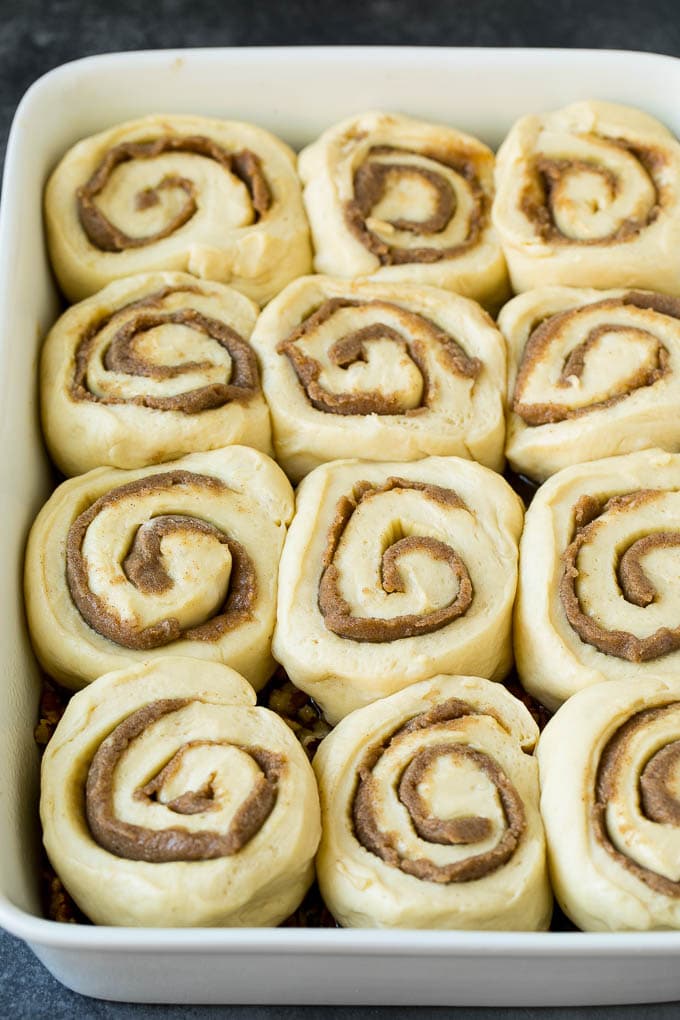 Sticky Buns Recipe | Sweet Rolls | Cinnamon Rolls #breakfast #brunch #cinnamon #pecans #sadud #bread Cinnamon swirl dough in a baking dish.