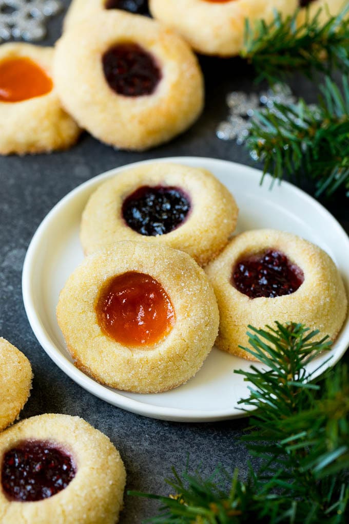Thumbprint Cookies | Sugar Cookies #cookies #baking #christmas #dessert #sadud A plate of jam filled thumbprint cookies.