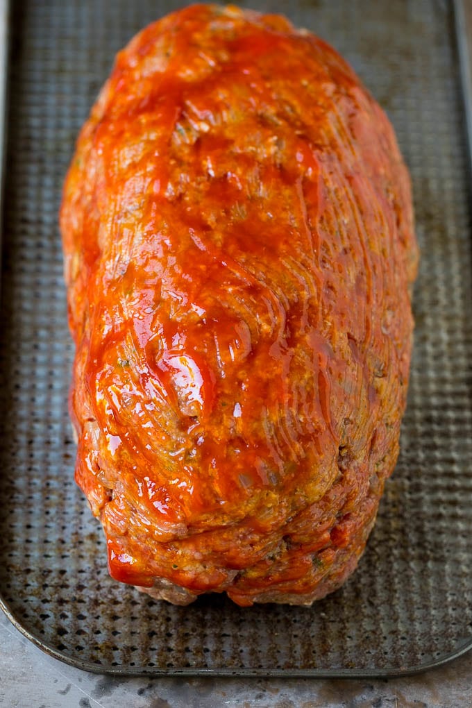 Bacon Wrapped Meatloaf Recipe | Beef Meatloaf #meatloaf #beef #groundbeef #bacon #dinner #sadud Ground beef shaped into a loaf and coated in ketchup.