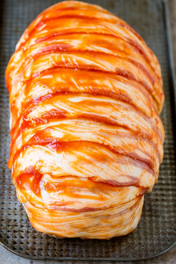 Bacon Wrapped Meatloaf Recipe | Beef Meatloaf #meatloaf #beef #groundbeef #bacon #dinner #sadud Raw slices of bacon wrapped around a seasoned ground beef loaf.