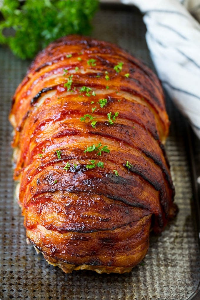 Bacon Wrapped Meatloaf Recipe | Beef Meatloaf #meatloaf #beef #groundbeef #bacon #dinner #sadud Meatloaf wrapped in slices of bacon and baked, then topped with parsley.