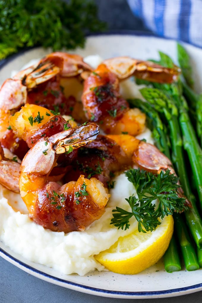 Bacon Wrapped Shrimp Recipe | Bacon Shrimp #shrimp #bacon #appetizer #dinner #sadud #seafood Bacon wrapped shrimp served over mashed potatoes with green beans.