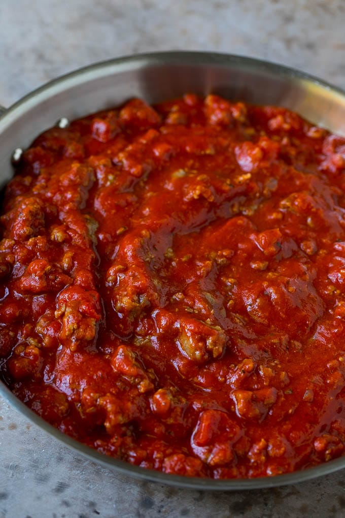 Baked Spaghetti Recipe | Baked Pasta #spaghetti #pasta #cheese #casserole #beef #sausage #dinner #sadud Meat sauce in a skillet.