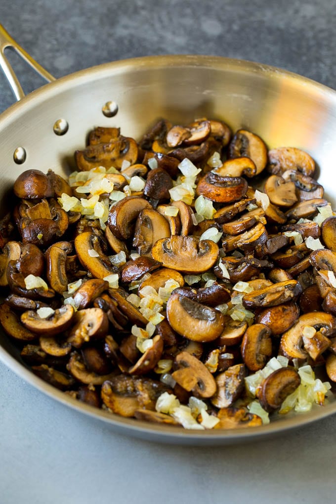Chicken Stroganoff Recipe | Chicken and Mushrooms #chicken #mushrooms #stroganoff #dinner #sadud Sauteed mushrooms and onions in a skillet.
