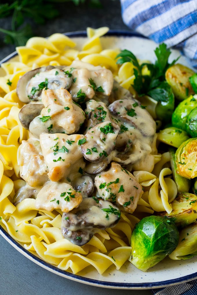 Chicken Stroganoff Recipe | Chicken and Mushrooms #chicken #mushrooms #stroganoff #dinner #sadud Chicken stroganoff over egg noodles with brussels sprouts on the side.
