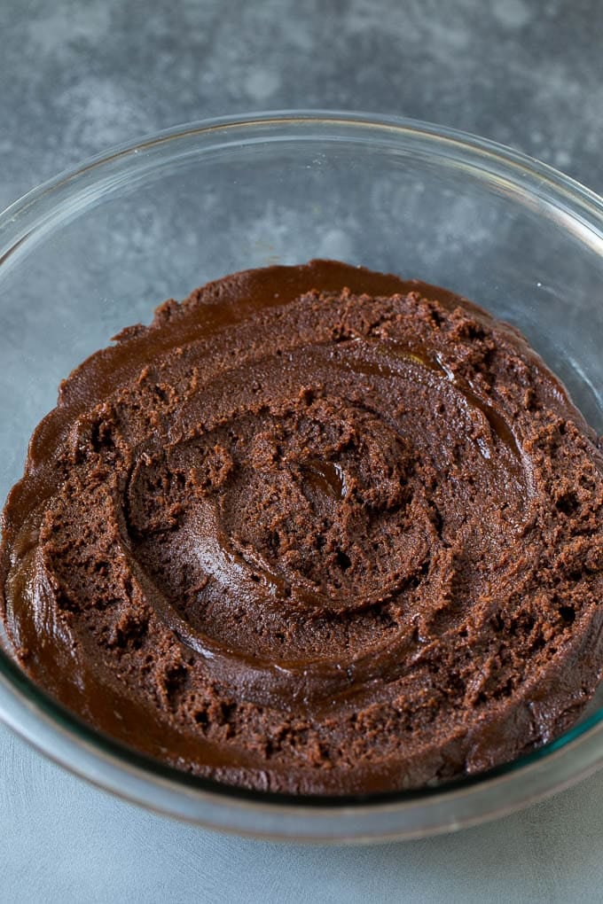 Chocolate Crinkle Cookies Recipe #cookies #chocolate #christmas #dessert #baking #sadud A bowl of chocolate cookie dough.