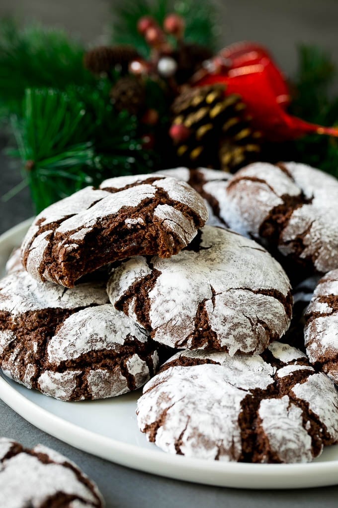 Chocolate Crinkle Cookies Recipe #cookies #chocolate #christmas #dessert #baking #sadud A plate of chocolate crinkle cookies.