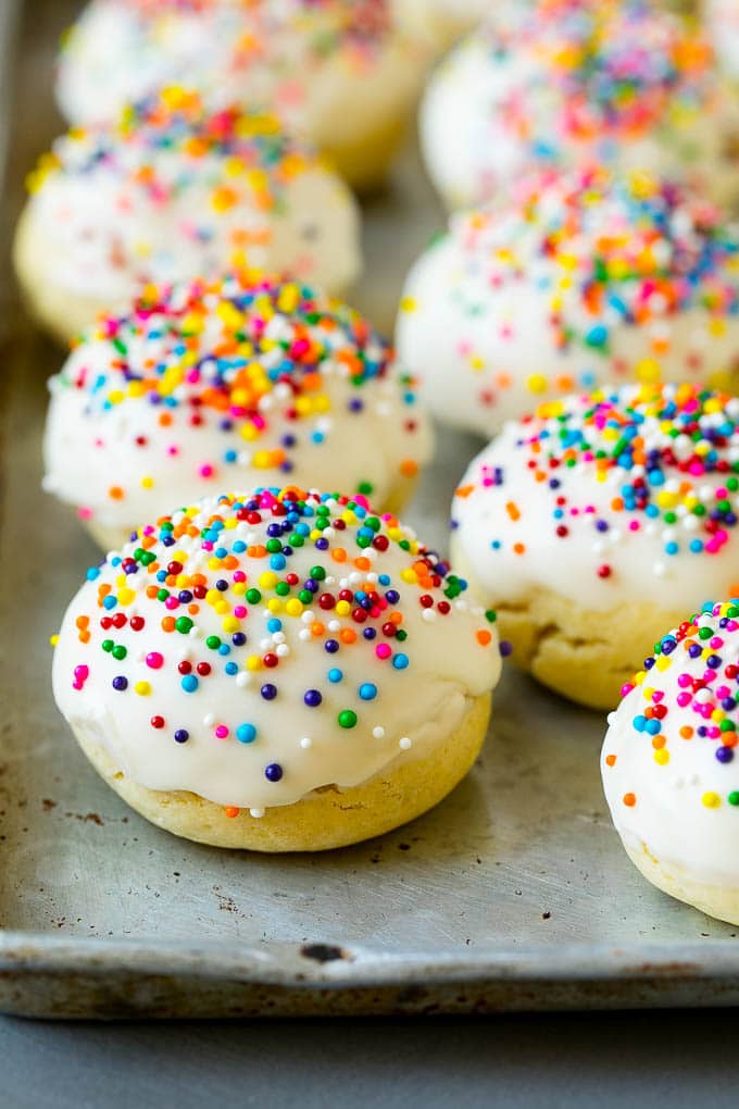 Italian Cookies Recipe | Almond Cookies #cookies #italianfood #frosting #sprinkles #baking #christmas #sadud Italian cookies covered in frosting and rainbow sprinkles.