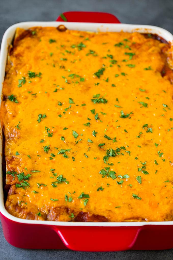Mexican Lasagna Recipe | Mexican Casserole #mexican #lasagna #groundbeef #beans #dinner #cheese #sadud A baked Mexican casserole topped with melted cheese and cilantro.