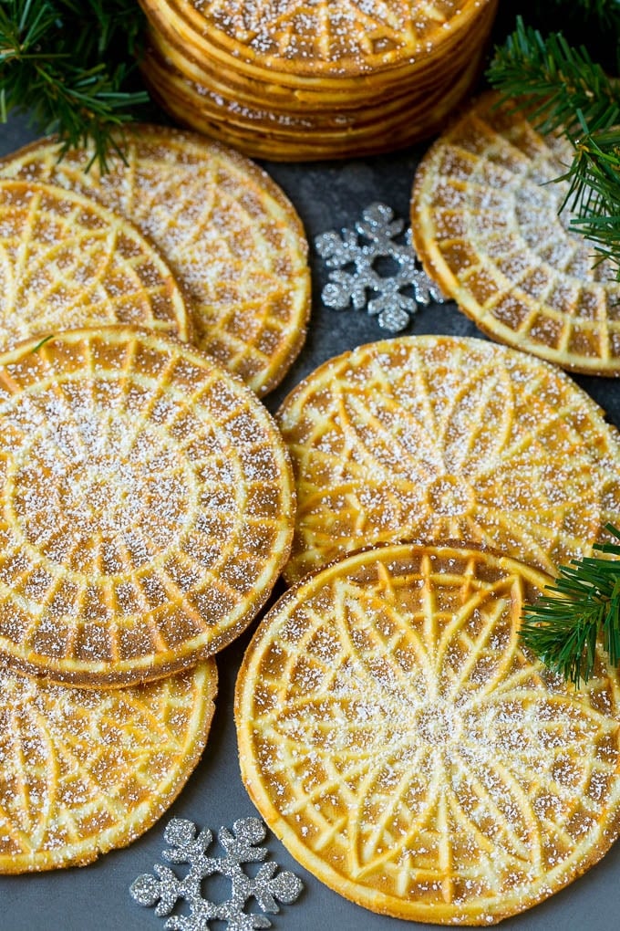 Pizzelle Cookies Recipe #cookies #baking #dessert #christmas #sadud Pizzelle cookies cooked to golden brown and coated in powdered sugar.