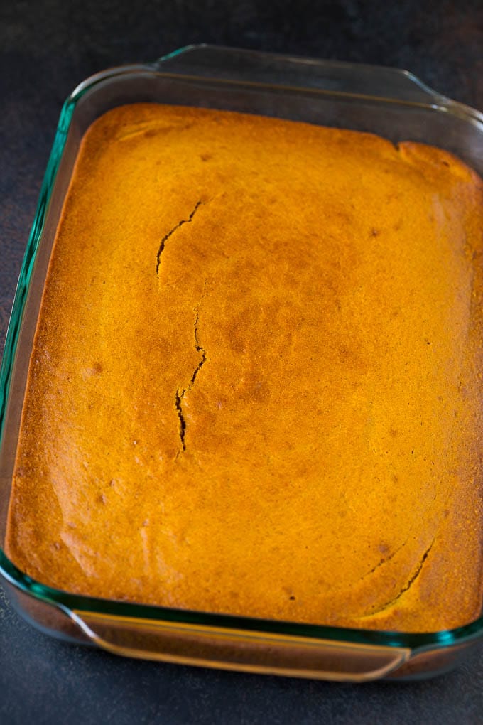 Pumpkin Cake Recipe | Pumpkin Spice Cake #cake #pumpkin #dessert #baking #fall #thanksgiving #sadud A baked base in a glass dish ready for frosting.