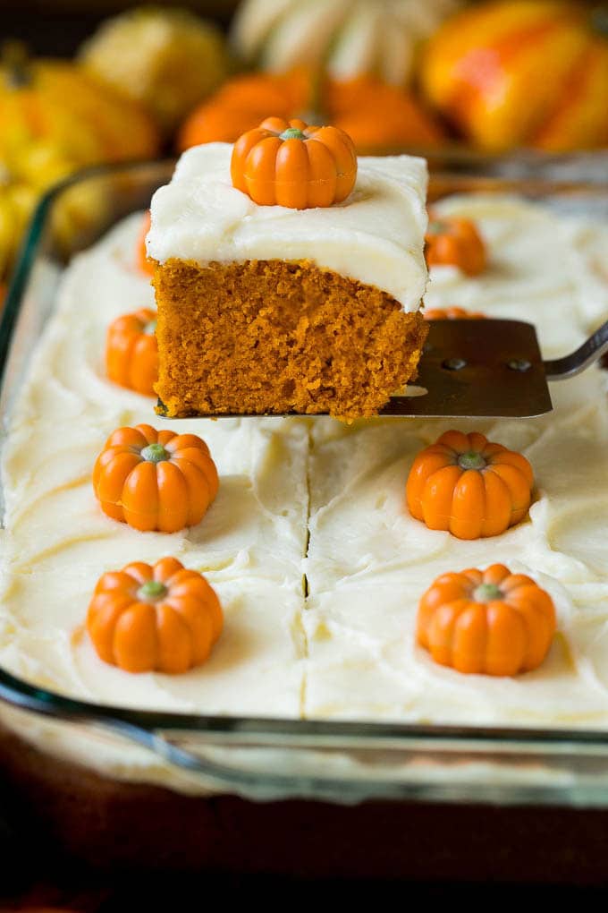 Pumpkin Cake Recipe | Pumpkin Spice Cake #cake #pumpkin #dessert #baking #fall #thanksgiving #sadud A spatula serving up a slice of pumpkin cake.