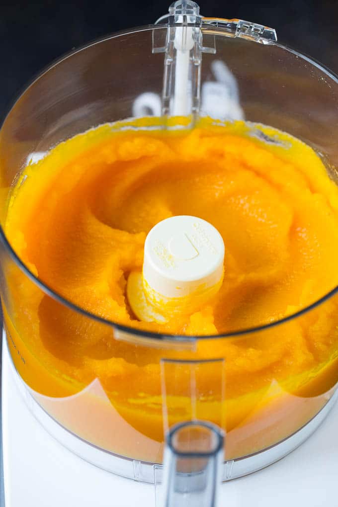 Pumpkin Puree Recipe #pumpkin #baking #fall #thanksgiving #sadud Pureed pumpkin in a food processor.