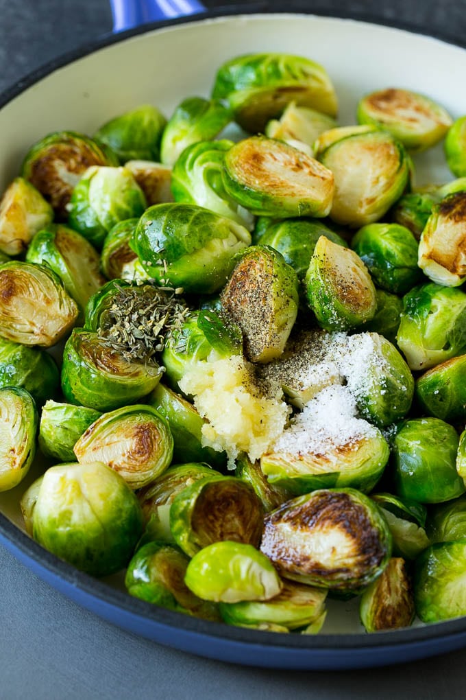Sauteed Brussels Sprouts Recipe | Brussels Sprouts Side Dish #brusselssprouts #sprouts #veggies #sidedish #garlic #vegetarian #dinner #sadud Sprouts in a pan seasoned with salt, pepper, garlic and dried herbs.