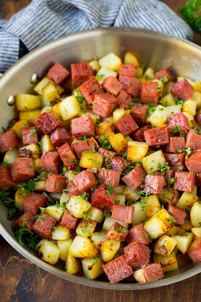 Corned Beef Hash Recipe #hash #cornedbeef #stpatricksday #breakfast #brunch #potatoes #sadud Corned beef hash with potatoes, onions and fresh herbs.