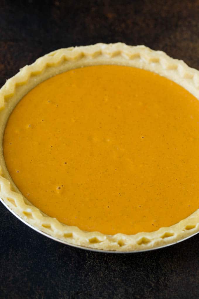 Homemade Pumpkin Pie Recipe | Pumpkin Pie #pie #pumpkin #baking #thanksgiving #fall #dessert #sadud Pie filling inside a pie crust.