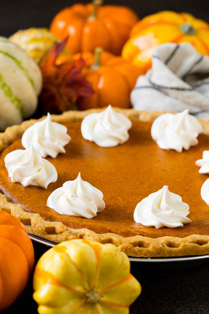 Homemade Pumpkin Pie Recipe | Pumpkin Pie #pie #pumpkin #baking #thanksgiving #fall #dessert #sadud Homemade pumpin pie topped with rosettes of whipped cream.