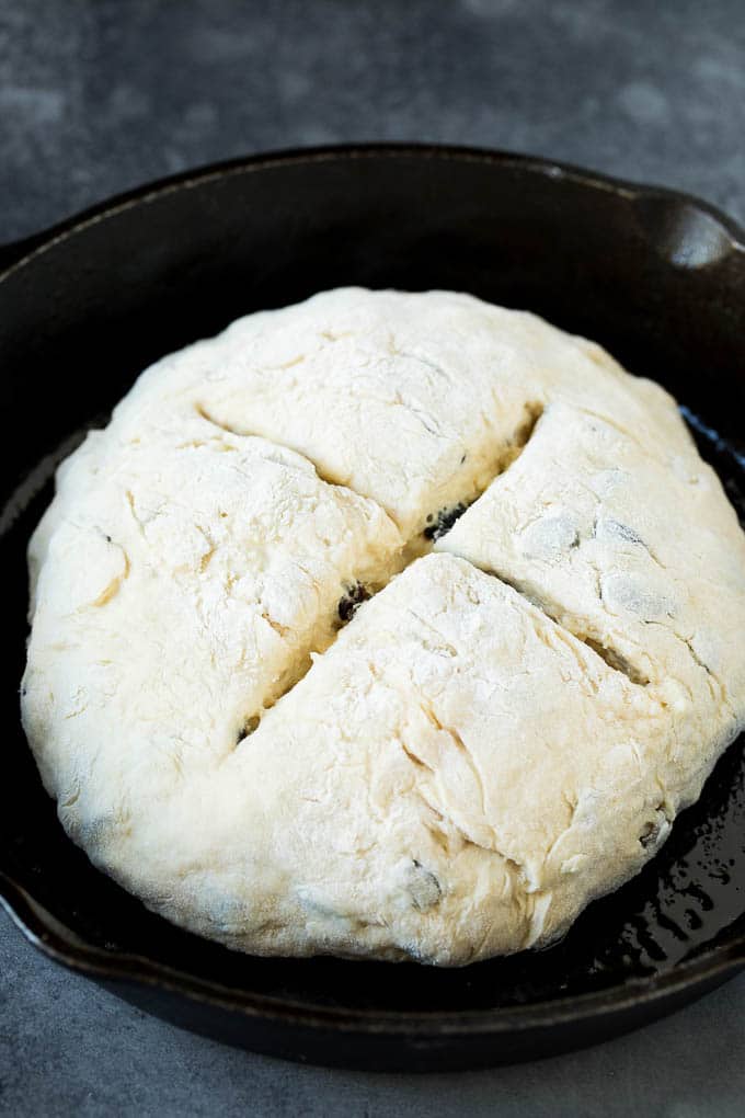 Irish Soda Bread Recipe #bread #baking #stpatricksday #sidedish #sadud A shaped loaf of soda bread in a skillet.