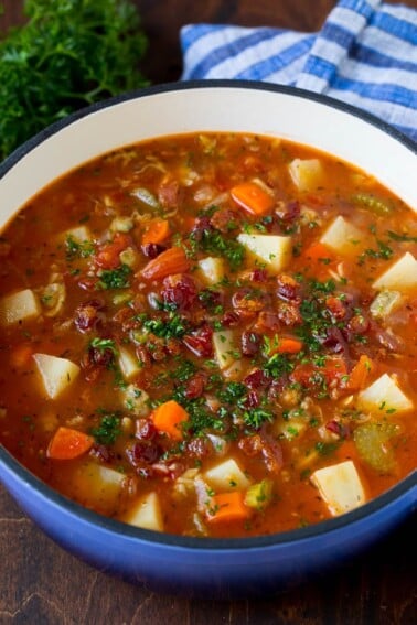 Manhattan clam chowder with tomatoes, potatoes, vegetables and bacon.