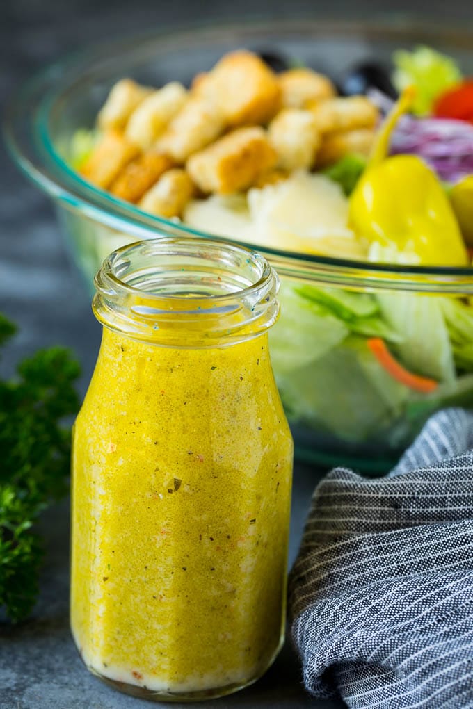 Olive Garden Salad Recipe | Italian Salad #salad #lettuce #olives #sidedish #dinner #sadud A bottle of homemade salad dressing.