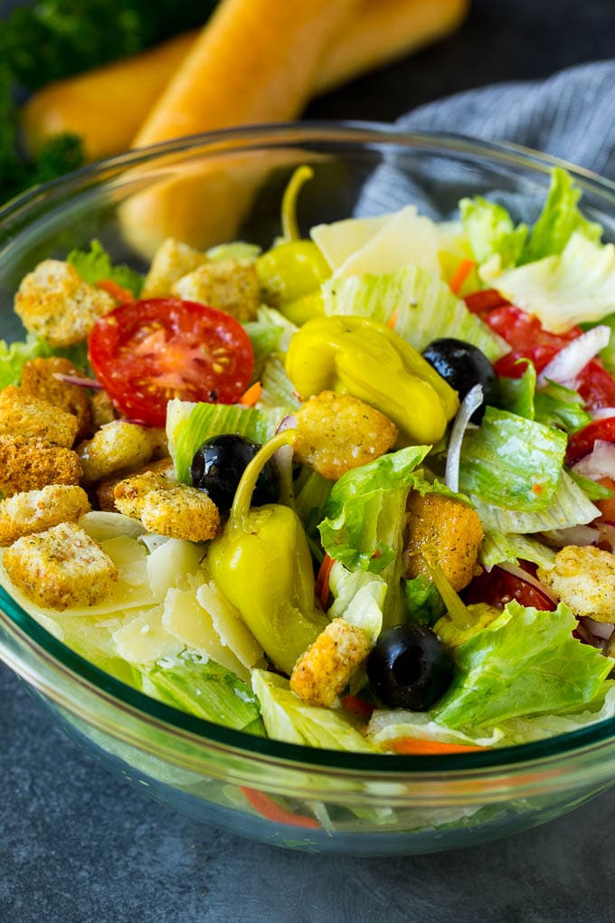 Olive Garden Salad Recipe | Italian Salad #salad #lettuce #olives #sidedish #dinner #sadud A tossed Olive Garden salad with Italian dressing, vegetables and olives.