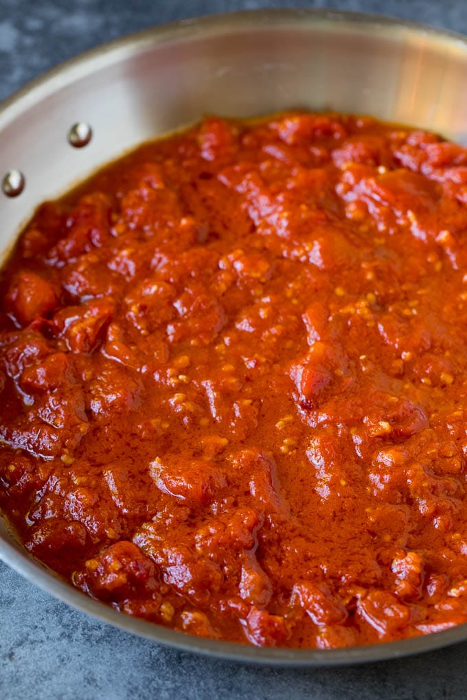 Pasta Puttanesca Recipe #pasta #tomatoes #olives #italianfood #dinner #sadud Homemade tomato sauce in a skillet.