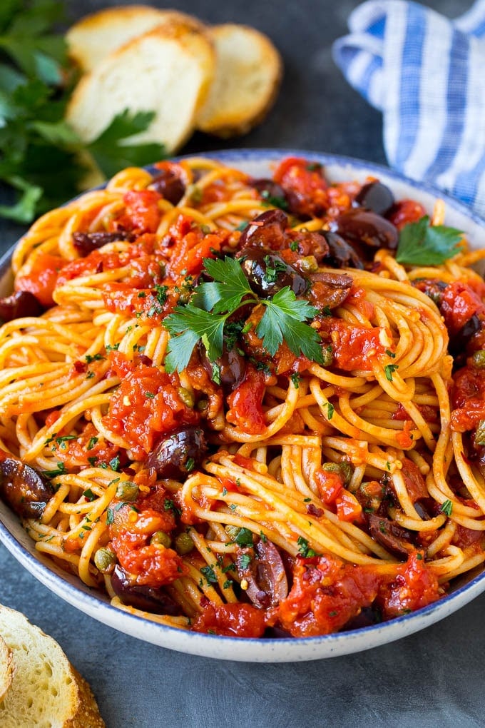 Pasta Puttanesca Recipe #pasta #tomatoes #olives #italianfood #dinner #sadud Pasta puttanesca with spaghetti tossed in a homemade tomato sauce.