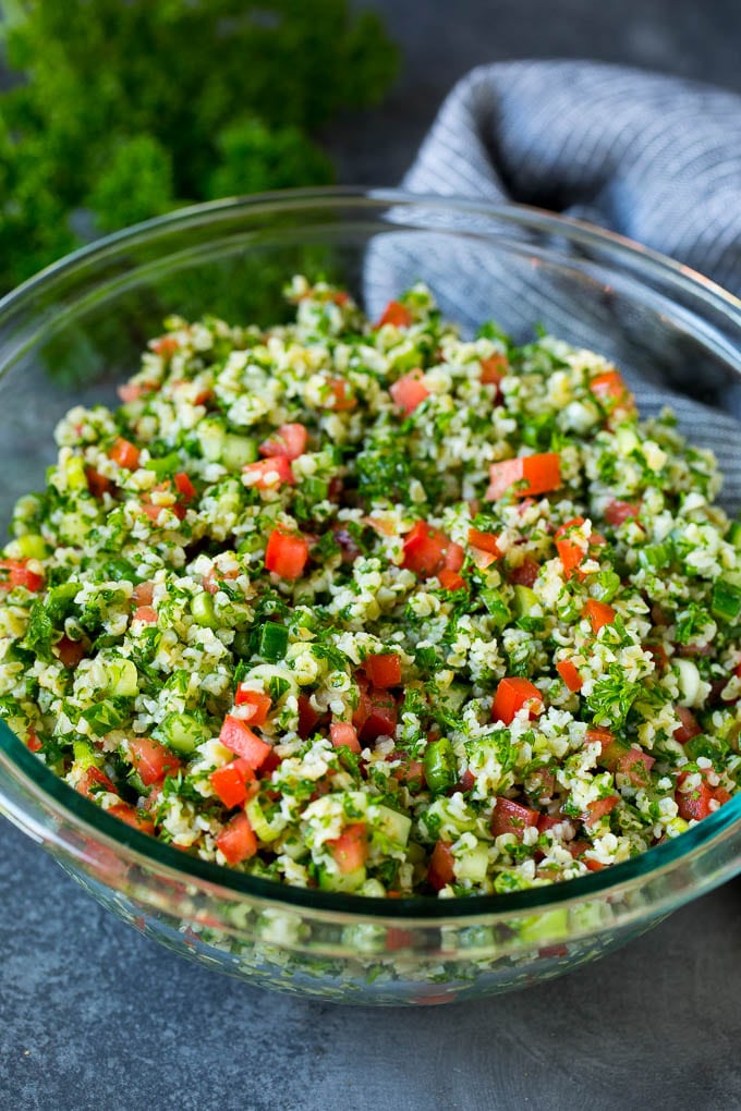 Tabbouleh Salad | Tabouli #salad #wheat #tomatoes #cucumber #healthy #sidedish #dinner #sadud A serving bowl filled with tabbouleh salad.