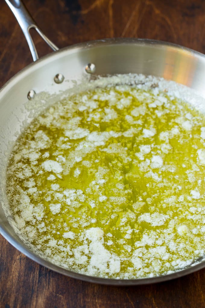 Garlic and Herb Angel Hair Pasta #pasta #garlic #sidedish #dinner #sadud Melted butter with garlic and olive oil in a pan.